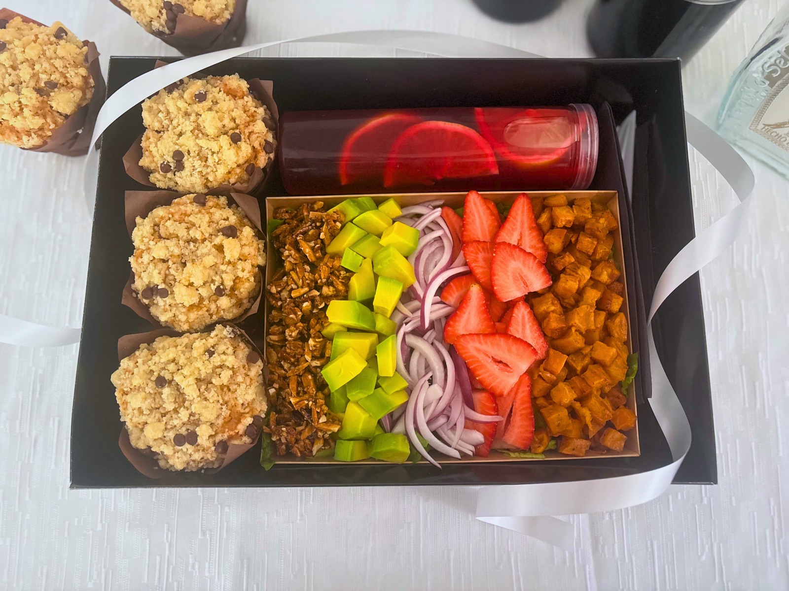 Mishloach Manos Package — black gift box with salad, muffins, and hibiscus tea